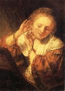 REMBRANDT Harmenszoon van Rijn Young Woman Trying on Earrings USA oil painting artist